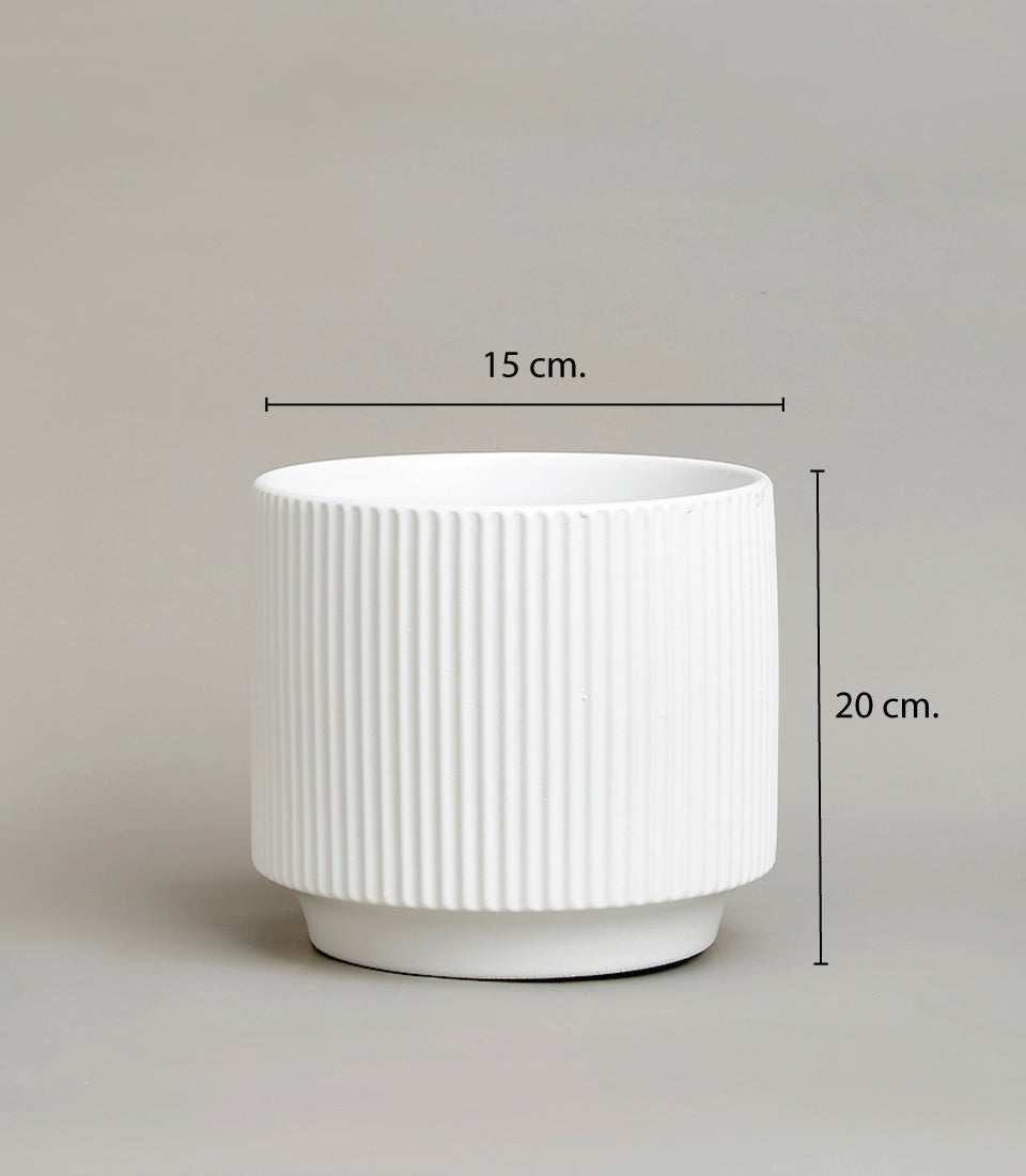 White ceramic vase with ribbed vertical stripe design, 20cm tall