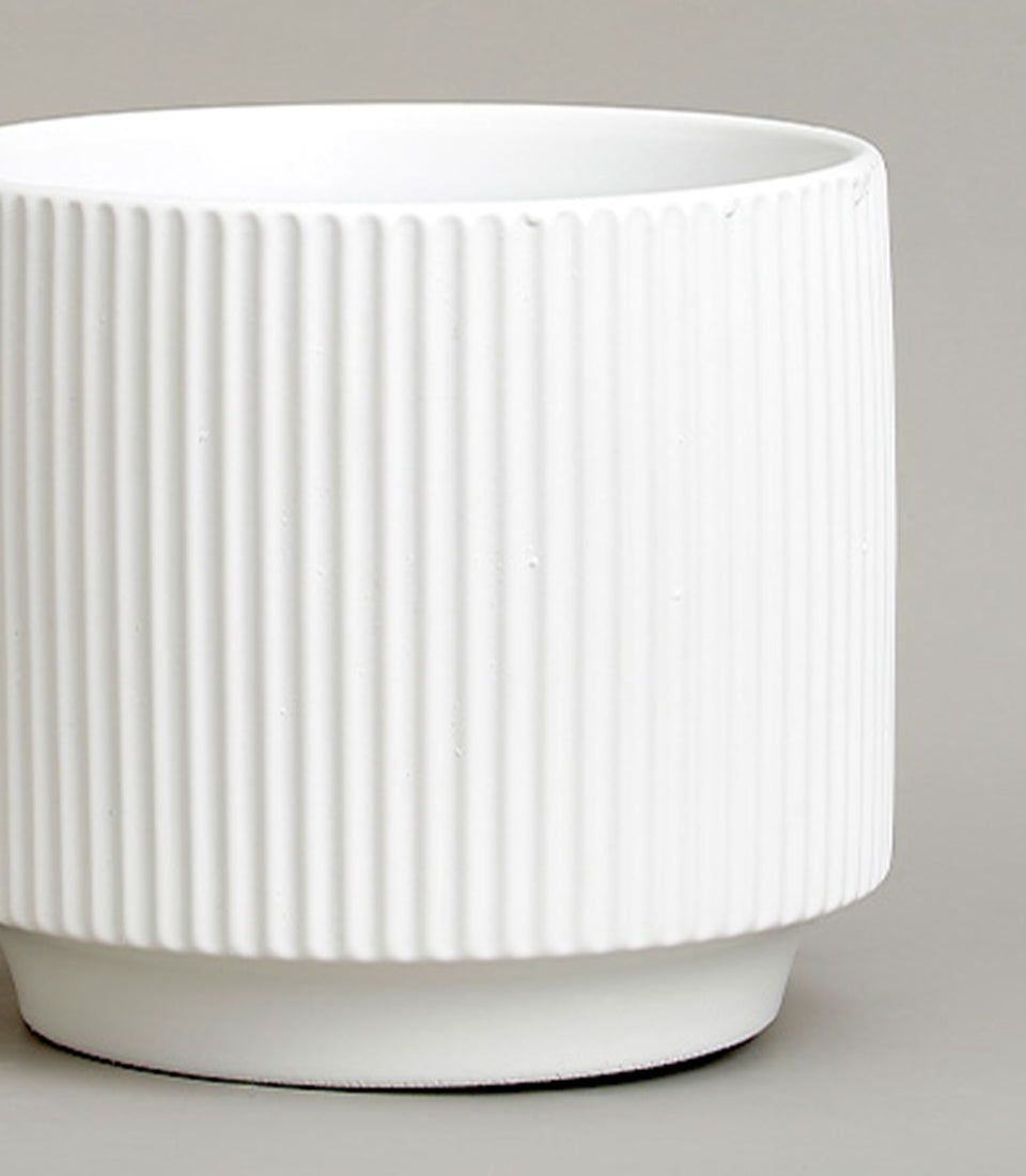 White ribbed ceramic vase with vertical fluting, perfect for fresh flowers or home décor gifting