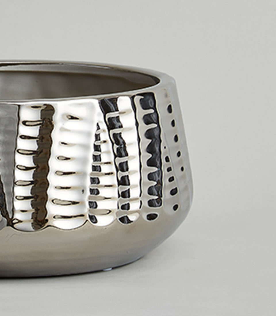 Chrome silver hammered vase with reflective finish and textured indentations for luxury home decor