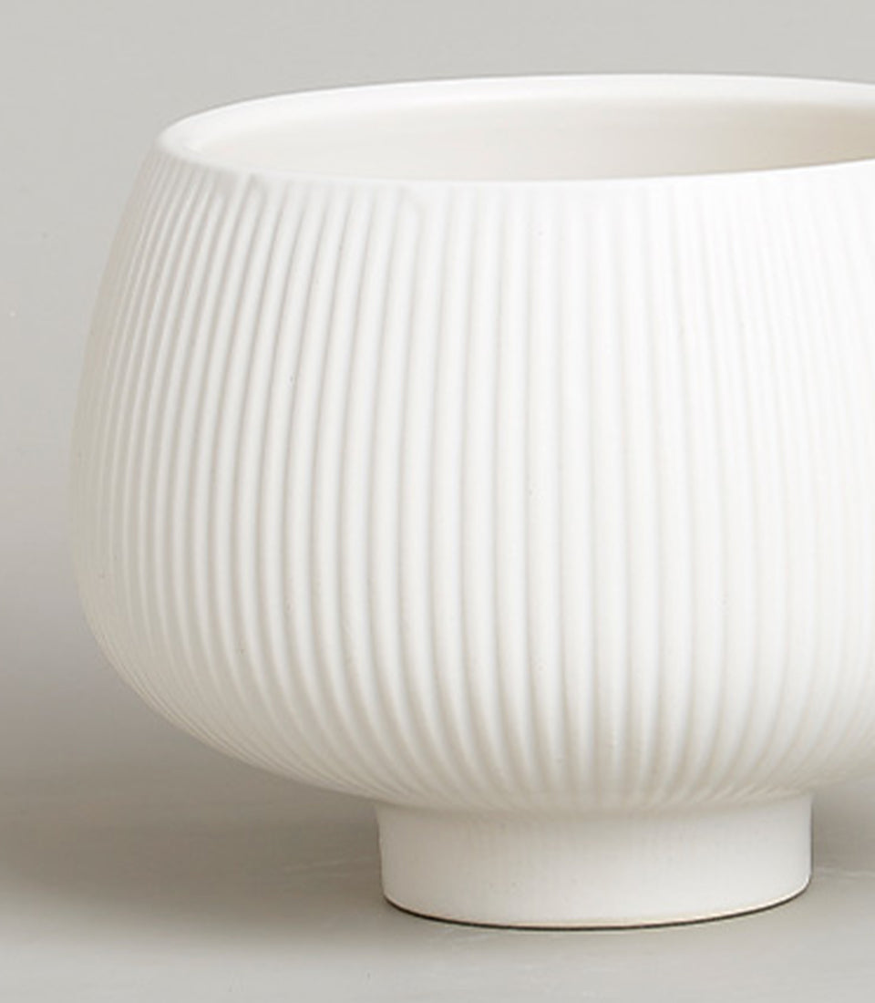 Elevated Serenity white ceramic vase with ribbed texture and rounded form