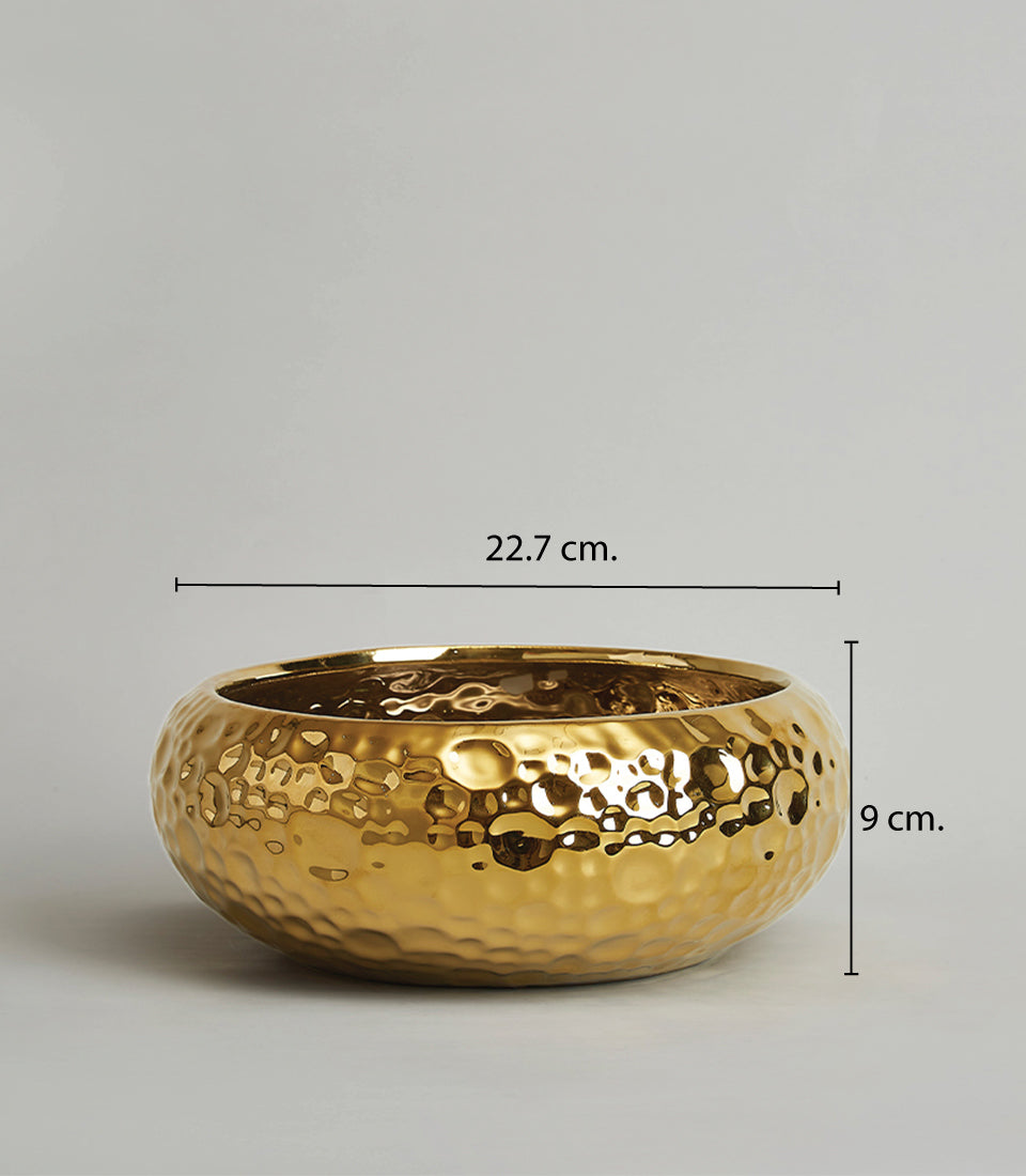 Large gold hammered ceramic bowl with dimpled metallic finish, 22.7 cm diameter
