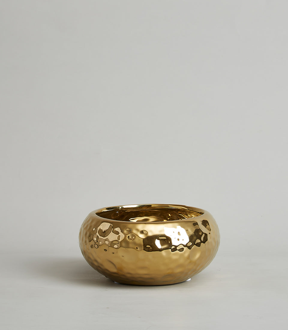 Gold hammered ceramic bowl with metallic finish, perfect for luxury gifting