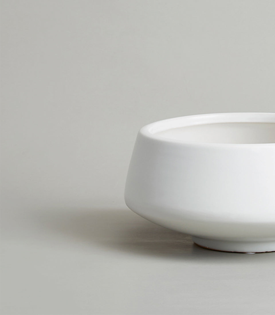 White ceramic bowl-shaped vase with glossy finish and tapered silhouette for premium gifting
