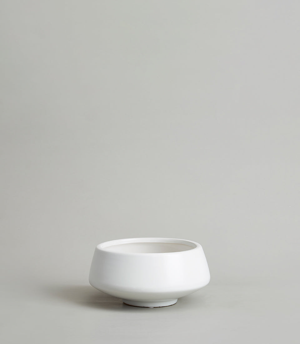 White ceramic bowl-shaped vase with modern minimalist design for premium gifting