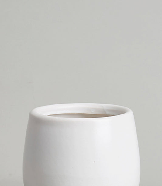 Minimalist white ceramic cylindrical vase with matte finish for fresh flowers or home décor