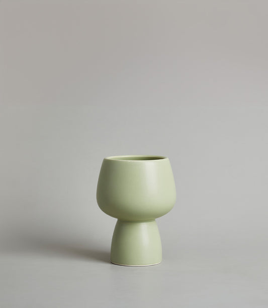 Modern light green ceramic chalice vase with matte finish and sculptural design