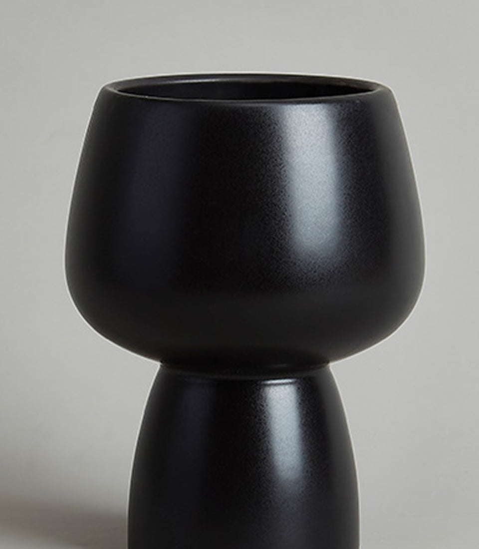 Black ceramic chalice vase with matte speckled finish and modern two-part silhouette