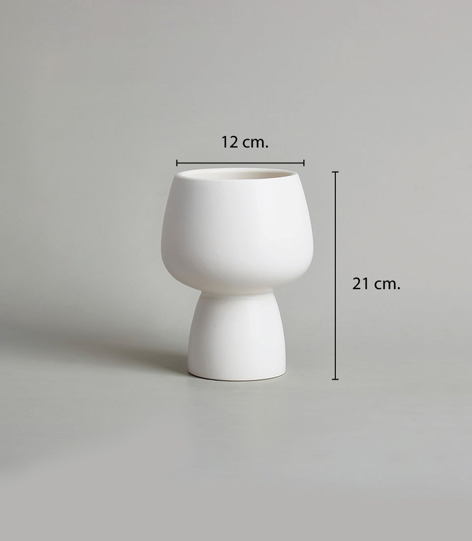 White ceramic vase with modern minimalist design for potted orchids and fresh flower arrangements
