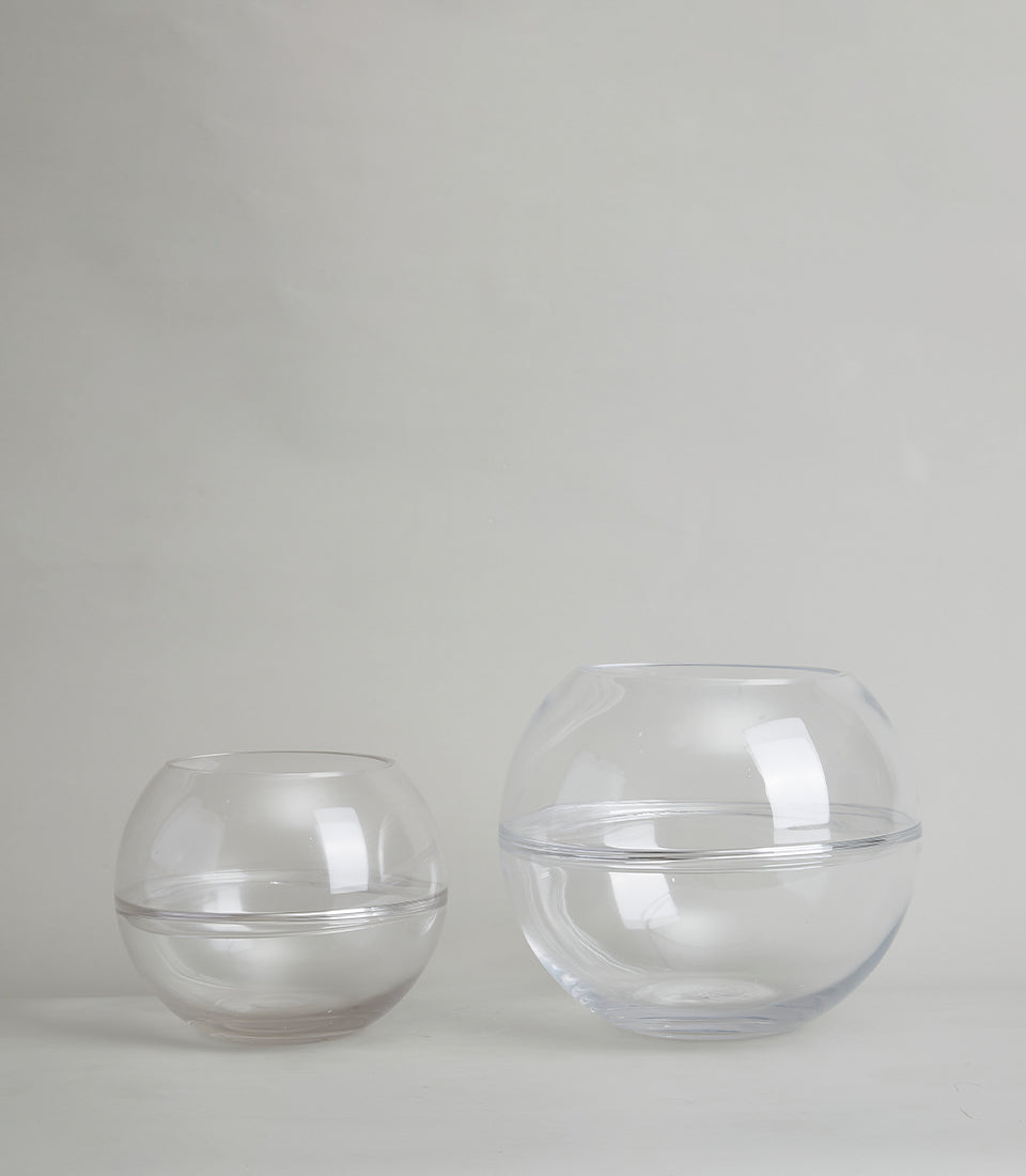 Clear glass bubble vases in smoky and transparent finishes, perfect for fresh flowers or standalone display