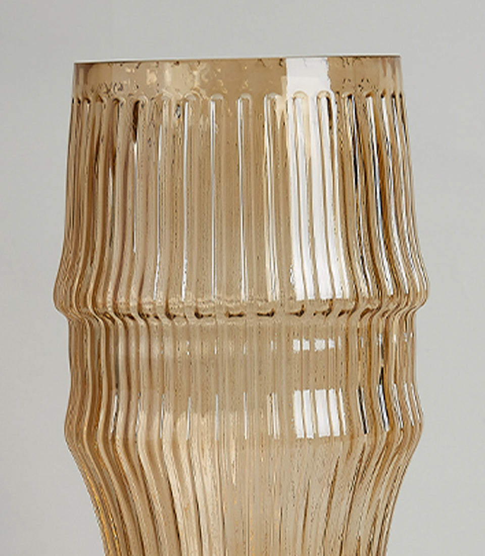 Tall amber ribbed glass vase with gold base and contemporary sculptural shape