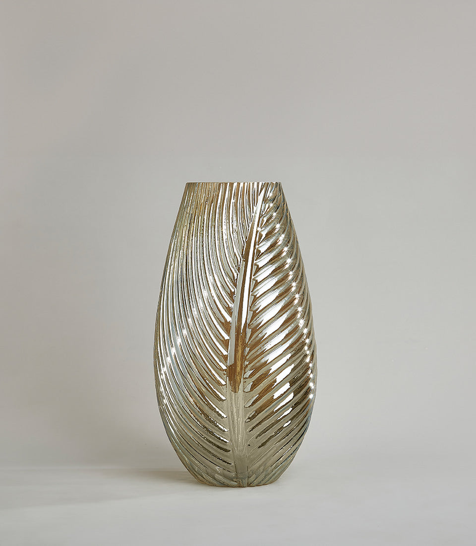 Tall silver leaf-patterned glass vase with metallic finish and ribbed organic texture