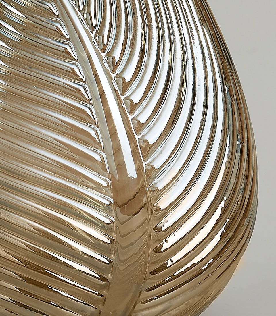 Elegant silver leaf-patterned glass vase with golden-brown translucent finish and metallic reflections