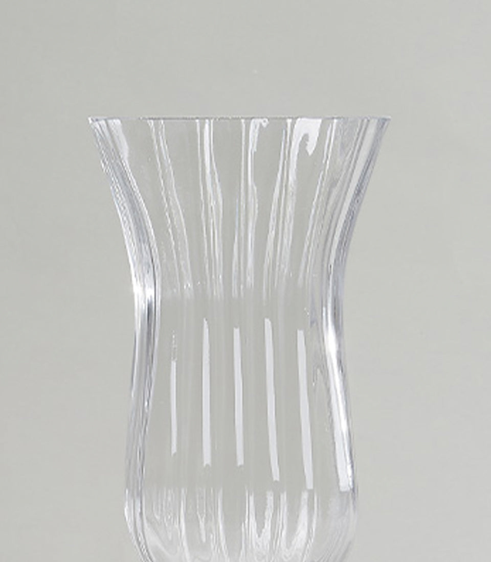 Pair of elegant ribbed glass vases with flared rims and organic curves, perfect for fresh flowers or luxury home decor