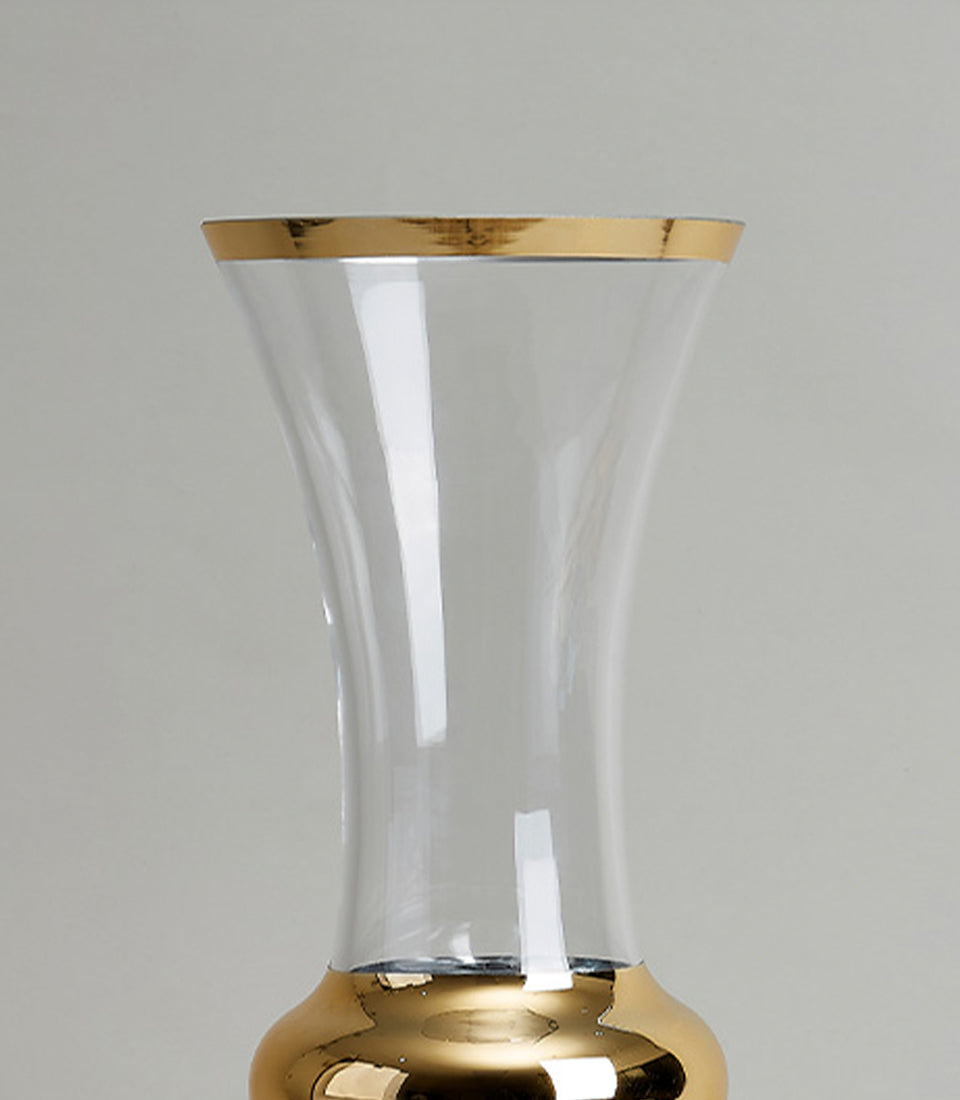 Clear glass vase with gold-trimmed rim and bulbous base, elegant home décor accent