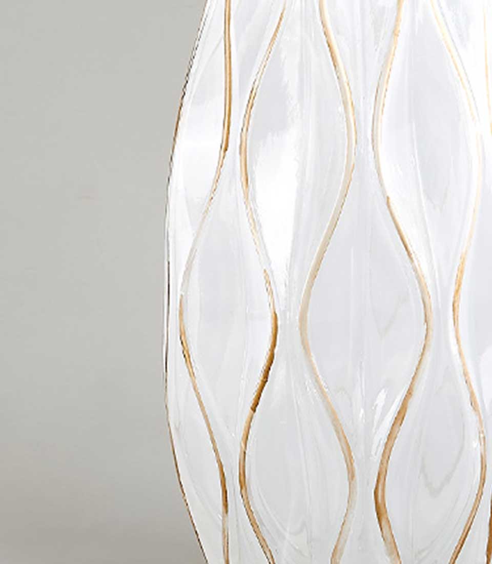 Elegant Ivory Waves vase from Flowers by Basketeer. Clear glass features soft, gold wave accents. Perfect for premium flower delivery in Bangkok.