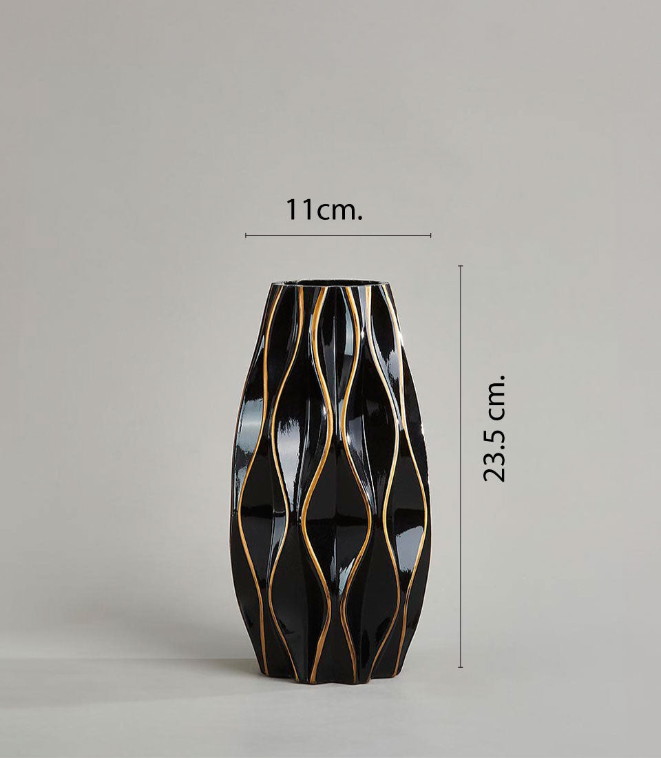 Black ceramic vase with gold-striped waves, elegant modern home décor accent