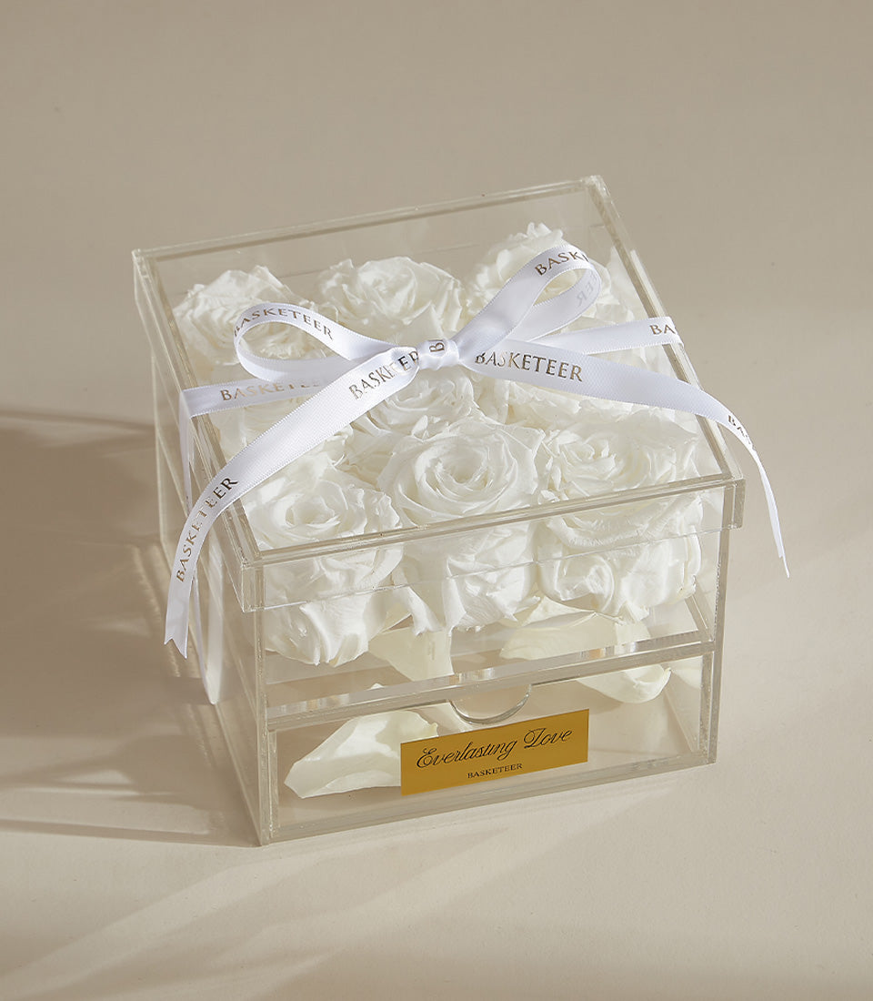 Luxury white preserved roses in clear acrylic box with petal drawer and Basketeer ribbon