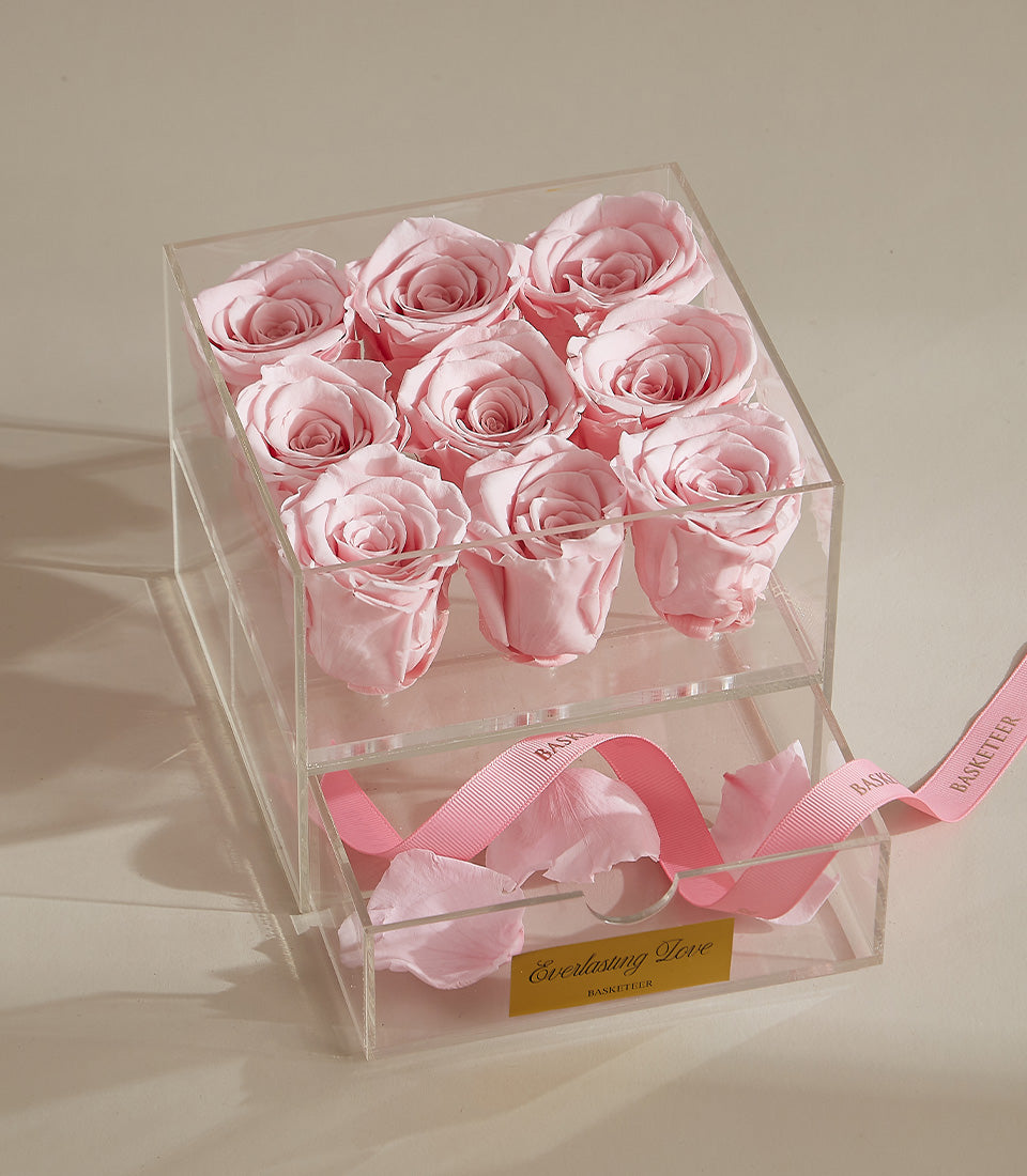 Luxury white preserved roses in clear acrylic box with pink ribbon and everlasting keepsake drawer