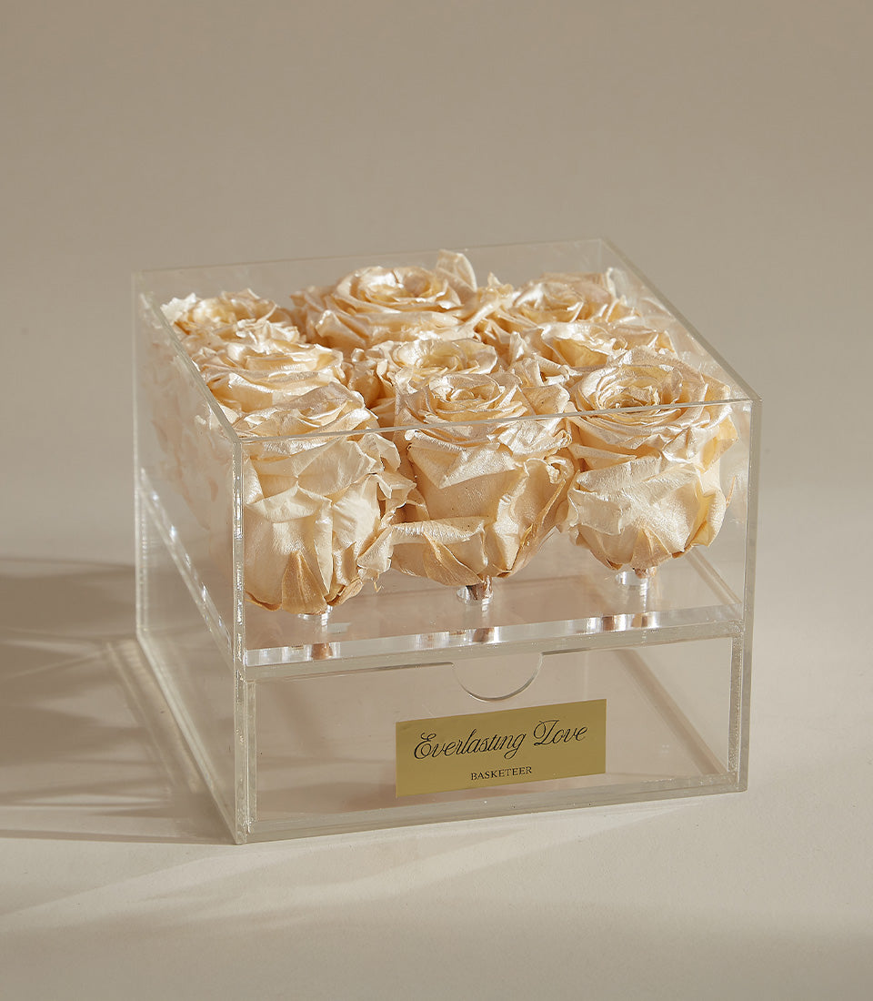 Metalized preserved rose box with nine cream beige roses in clear acrylic, gold-labeled drawer with Everlasting Love