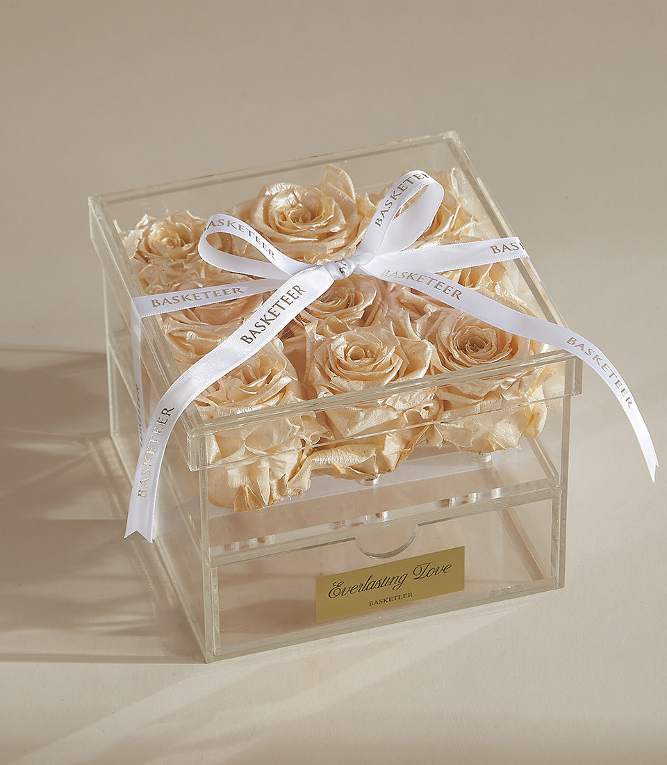Champagne preserved roses in clear acrylic gift box with white ribbon bow and gold Everlasting Love label