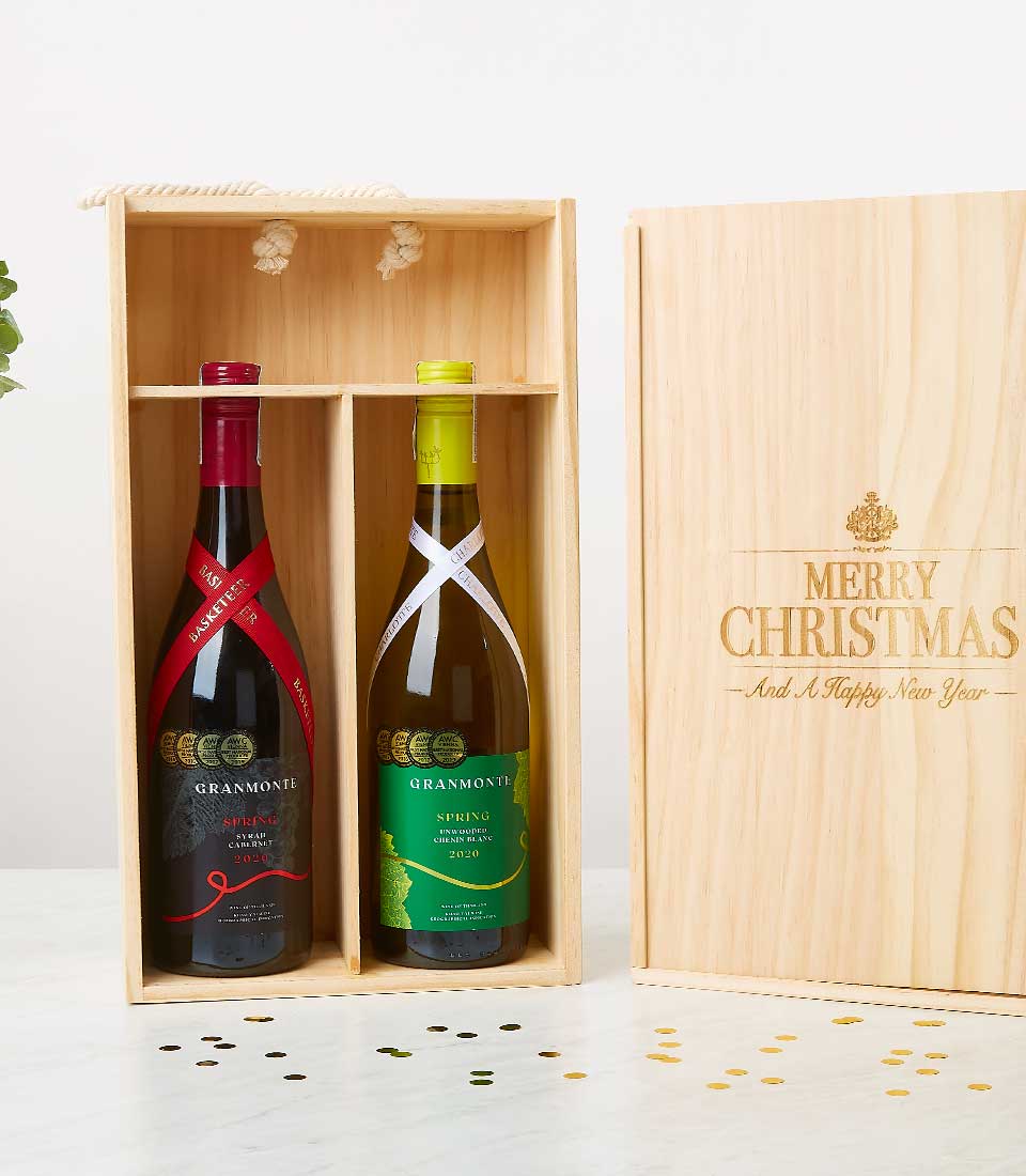 Wooden wine gift box with award-winning Cabernet and Chenin Blanc, engraved festive lid, gold confetti