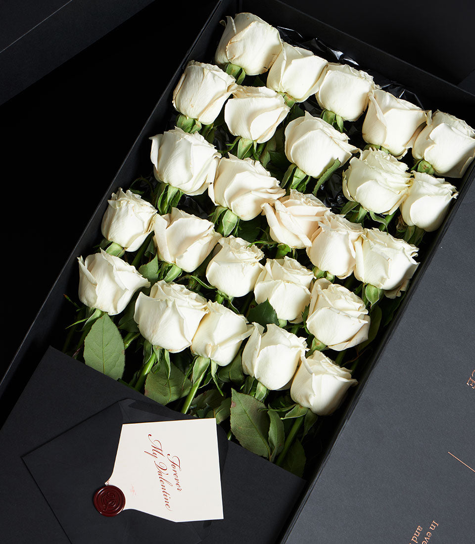 Playa Blanca luxury white roses in black VIP box with love letter for Valentine's Day