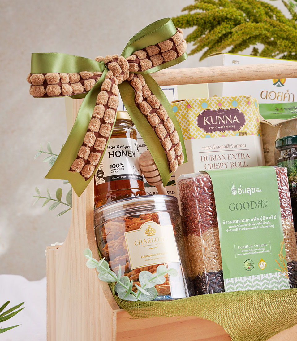 Healthy Coffee and Doi Kham wellness gift basket with honey, specialty rice, and gourmet snacks in wooden crate