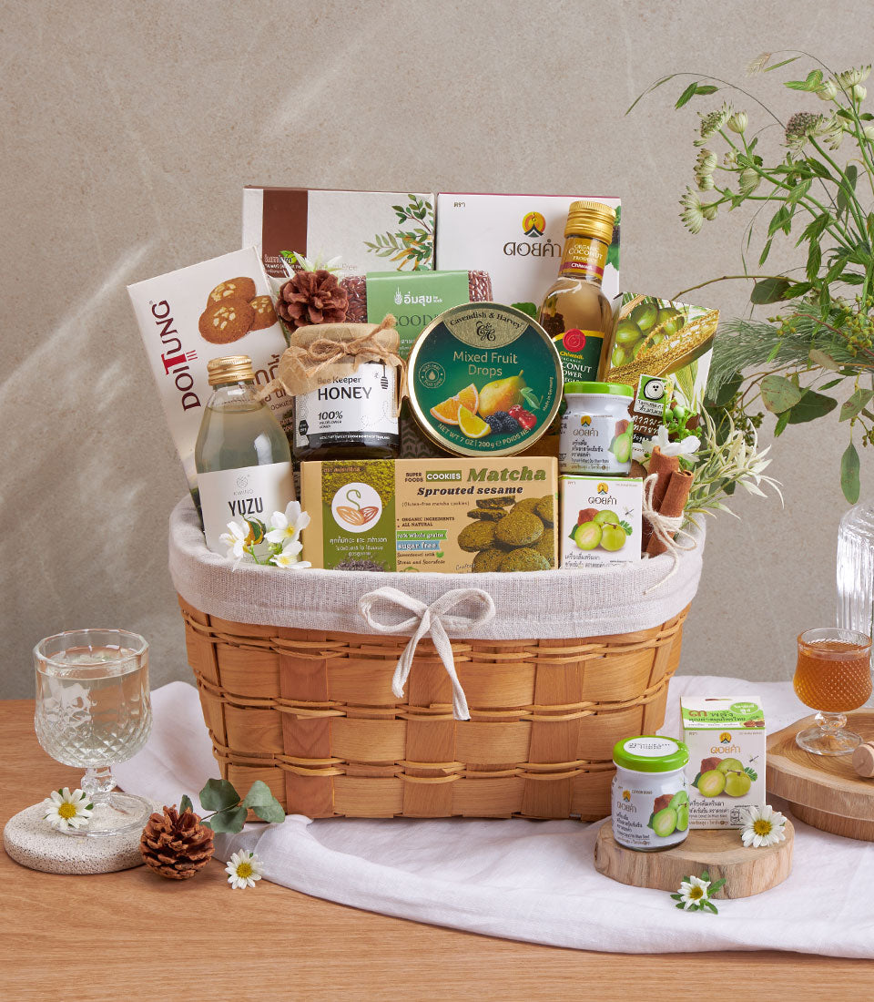Premium wellness gift basket with organic superfoods, yuzu drink, raw honey, matcha cookies, and coconut oil