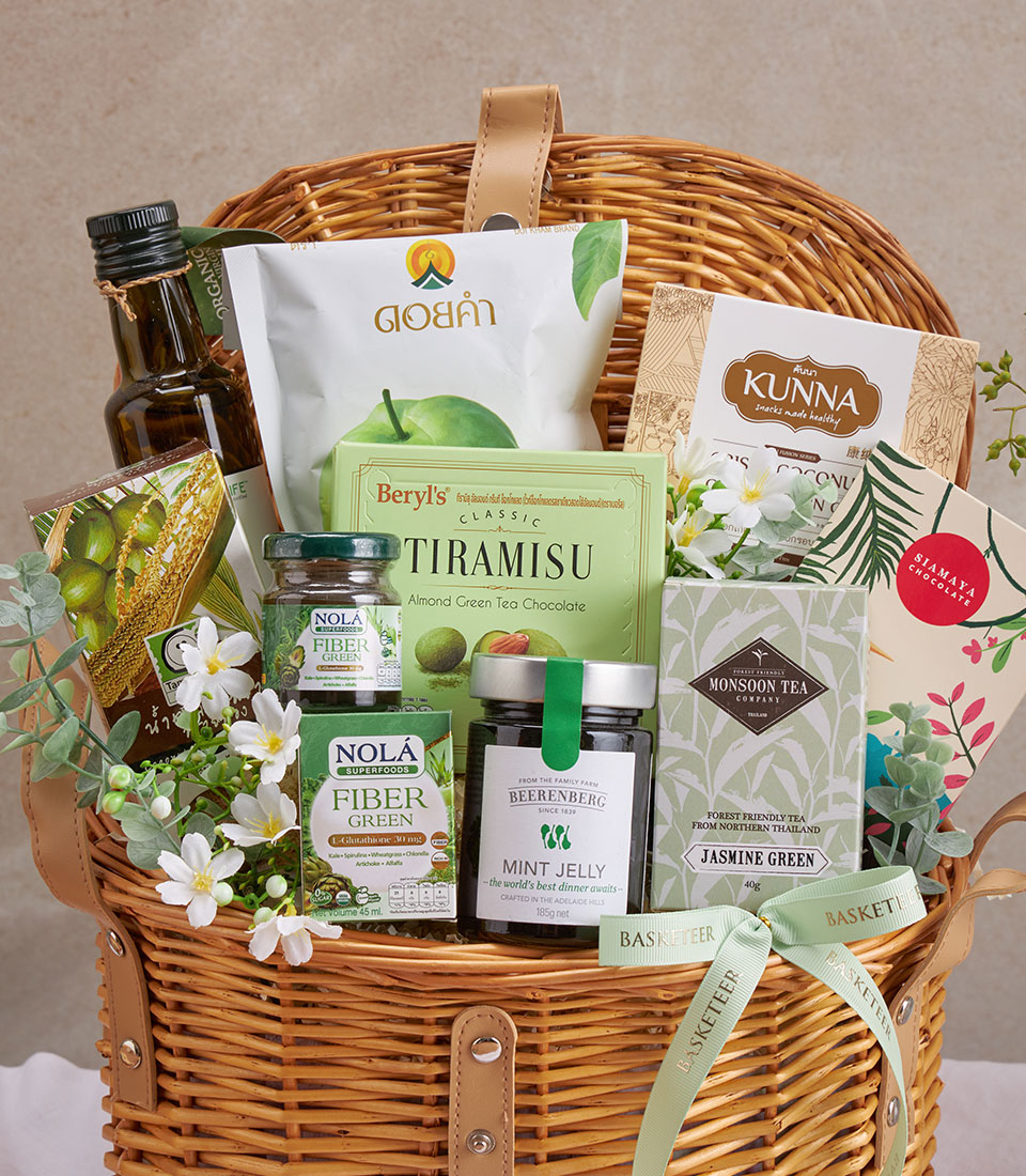 Premium olive oil and green wellness gourmet gift basket with artisan tea, superfoods, and chocolates
