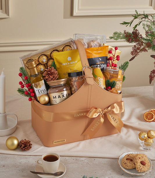 Luxury leather tote gift basket with gourmet treats, mango drink, truffle oil, and festive holiday styling for New Year