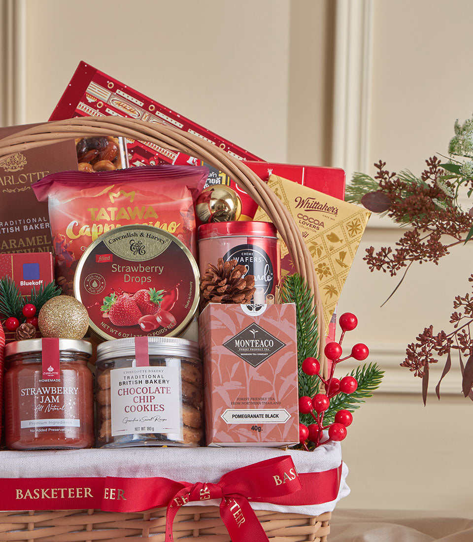Red velvet gourmet gift hamper with chocolates, cookies, jam, and festive decorations for New Year celebrations