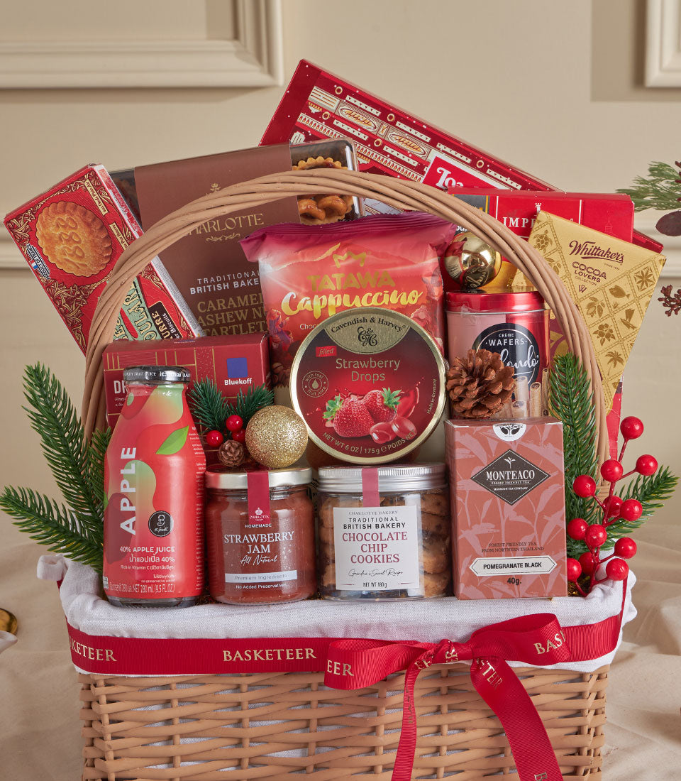 Red velvet wicker gift basket with gourmet treats, jam, cookies, and festive decorations for New Year gifting