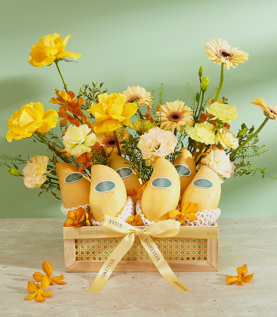 Premium Si Thong mango gift basket with yellow roses and tropical florals in woven wooden crate