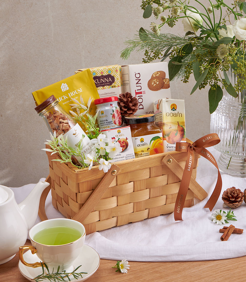 Premium wellness hamper with herbal tea, spices, and gourmet treats in woven basket