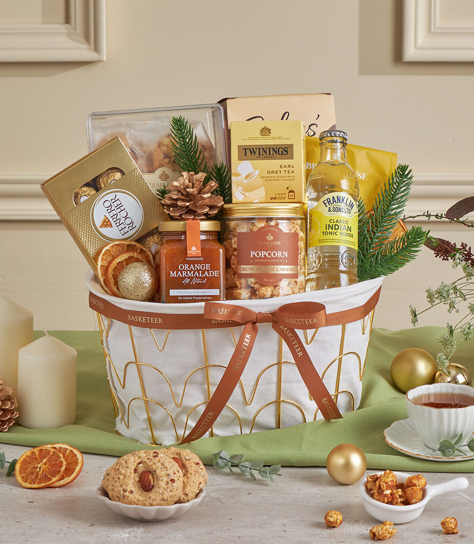 Almond & citrus luxury gift basket with Ferrero Rocher, Earl Grey tea, marmalade, and festive gold accents