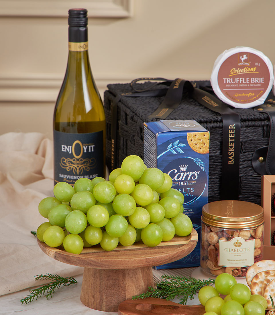 Luxury cabernet and gourmet cheese gift basket with sauvignon blanc, truffle brie, crackers, and fresh grapes