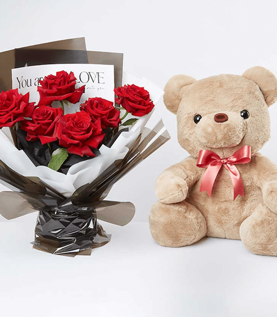 Red roses bouquet with cuddly teddy bear and satin bow, romantic gift combo