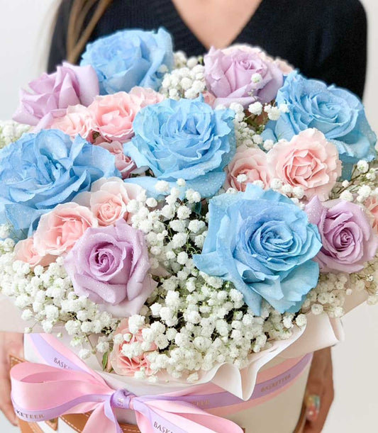 Pastel rose bouquet with baby's breath in white gift box, tied with pink and lavender ribbons