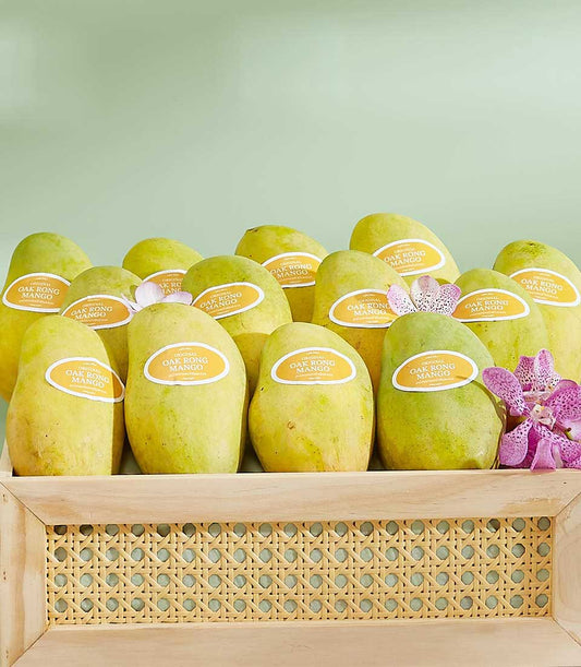 Premium Thai Oak Rong mangoes in handcrafted wooden gift box with fresh orchids