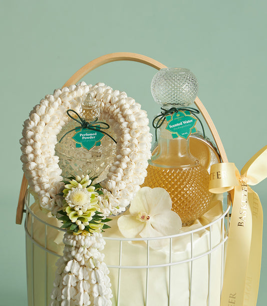 White wire gift basket with perfumed powder and scented water bottles, jasmine garland and orchid for Thai New Year Songkran