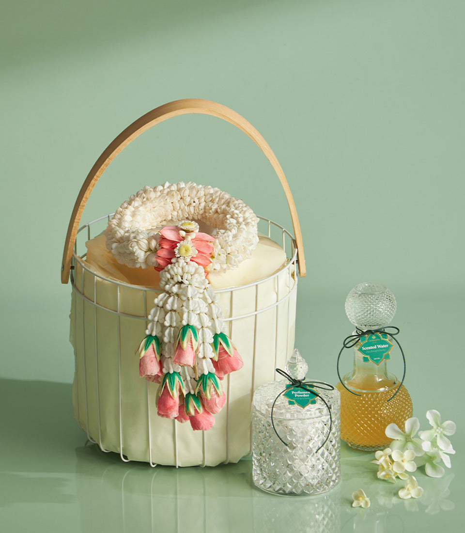 Traditional Thai jasmine phuang malai garland basket with perfumed powder and scented water for Songkran celebration