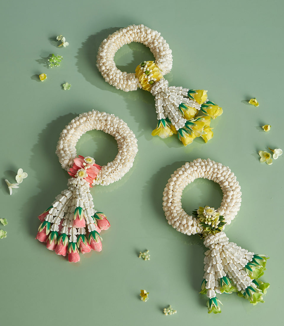 Traditional Thai jasmine garlands with colorful tassels for Songkran celebrations