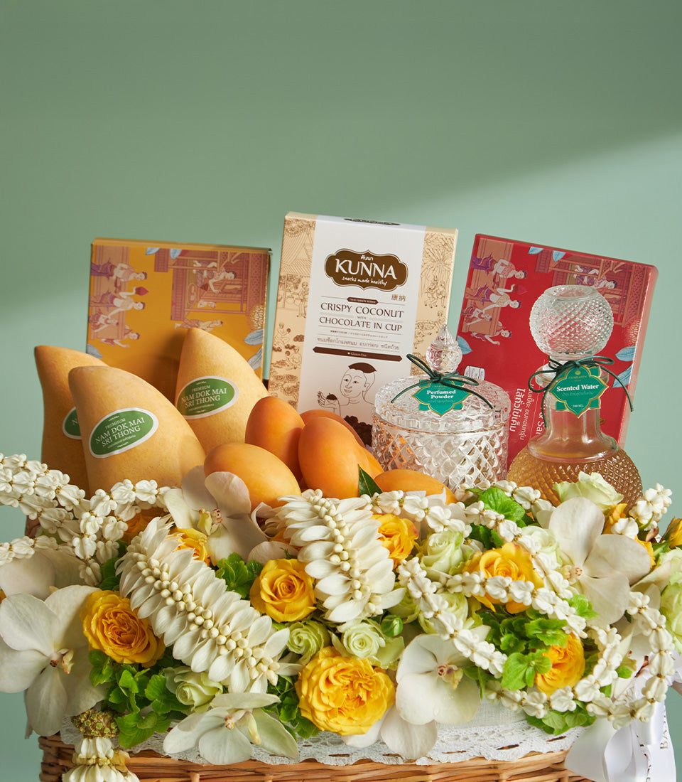 Prosperity Songkran gift hamper with Nam Doc Mai mangoes, Thai chocolates, scented essentials, and white orchids