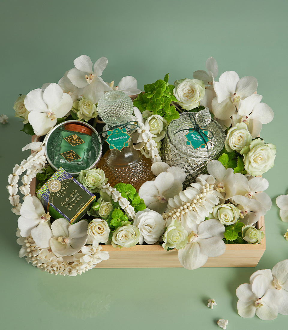 Songkran floral blessing gift set with scented water, perfume powder, and white orchids in wooden box
