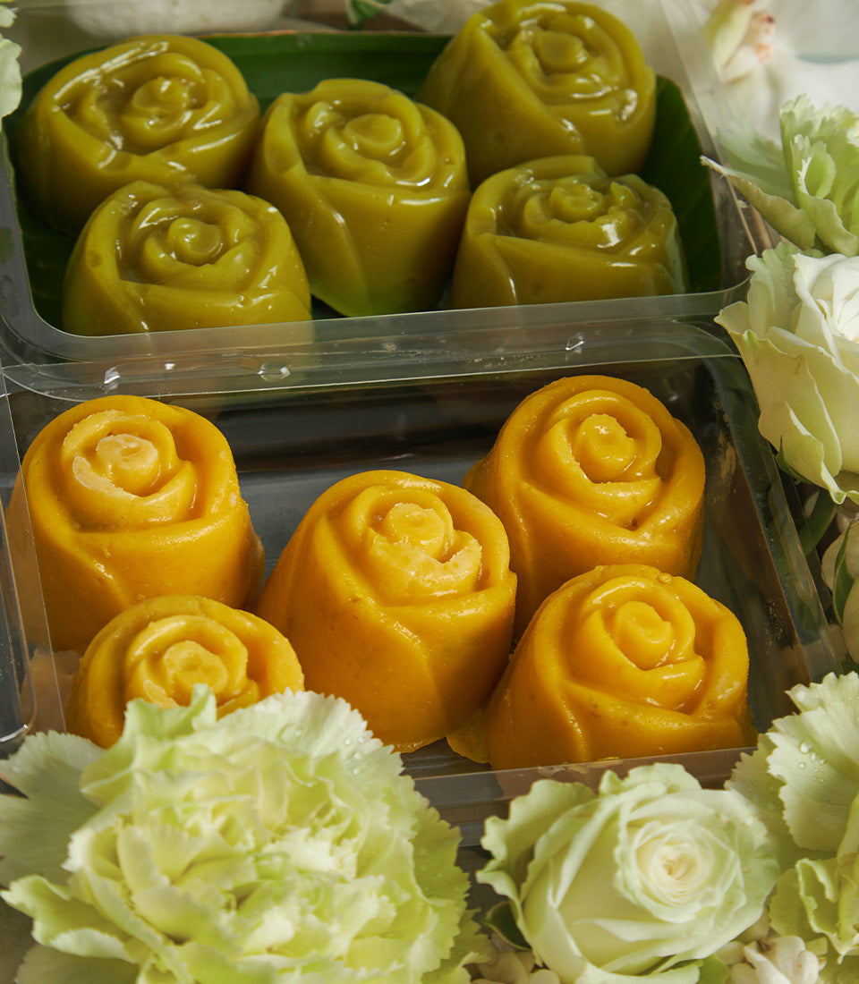 Songkran Sweet Blessing Box with rose-shaped desserts, fresh white roses and green carnations in luxury gift arrangement