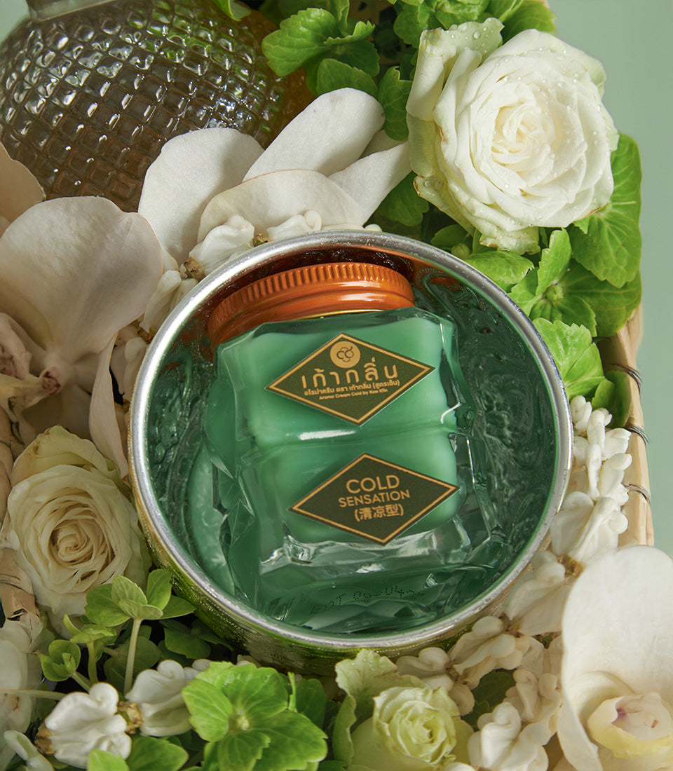 Thai Songkran gift set with cooling balm, fresh white roses, and orchids for new year wellness