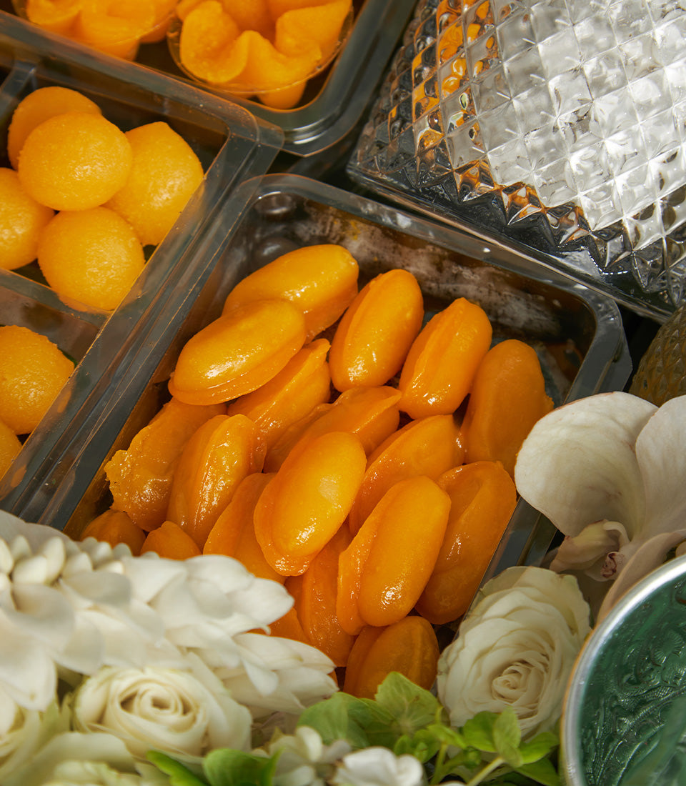 Thai auspicious golden desserts with fresh roses and orchids, Songkran New Year gift set