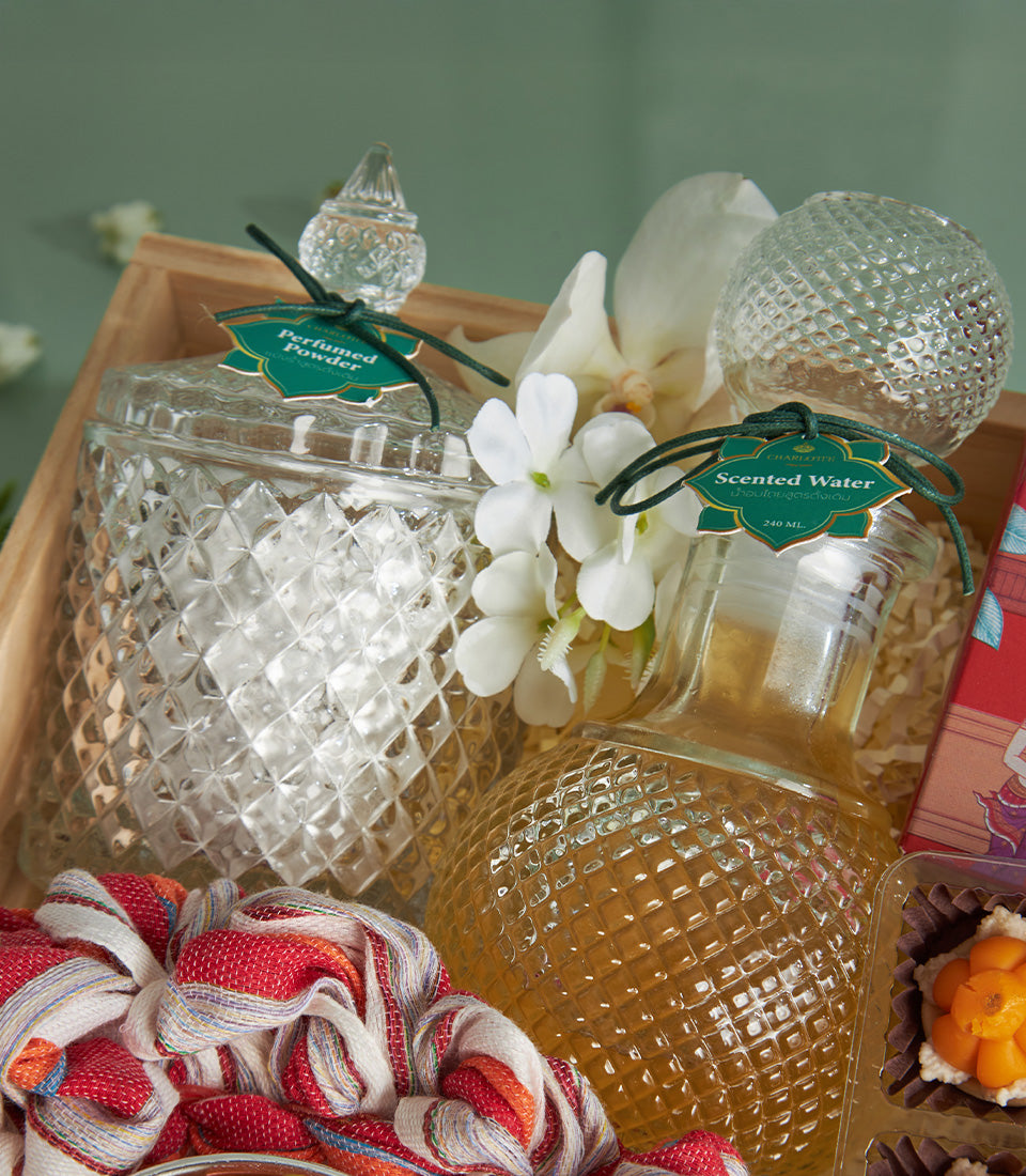 Sacred Songkran Thai Treats gift set with perfumed powder, scented water, and floral confections in wooden tray