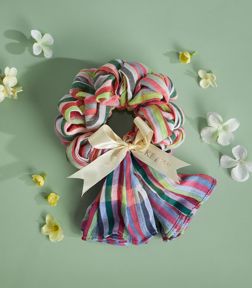 Colorful striped Pha-Kao-Ma Thai garland gift with cream ribbon bow, festive Songkran decoration