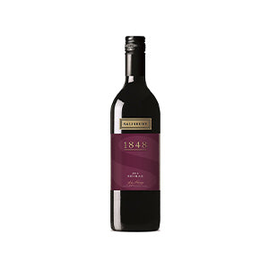 Premium red wine bottle with gold and burgundy label, perfect for Christmas gift giving